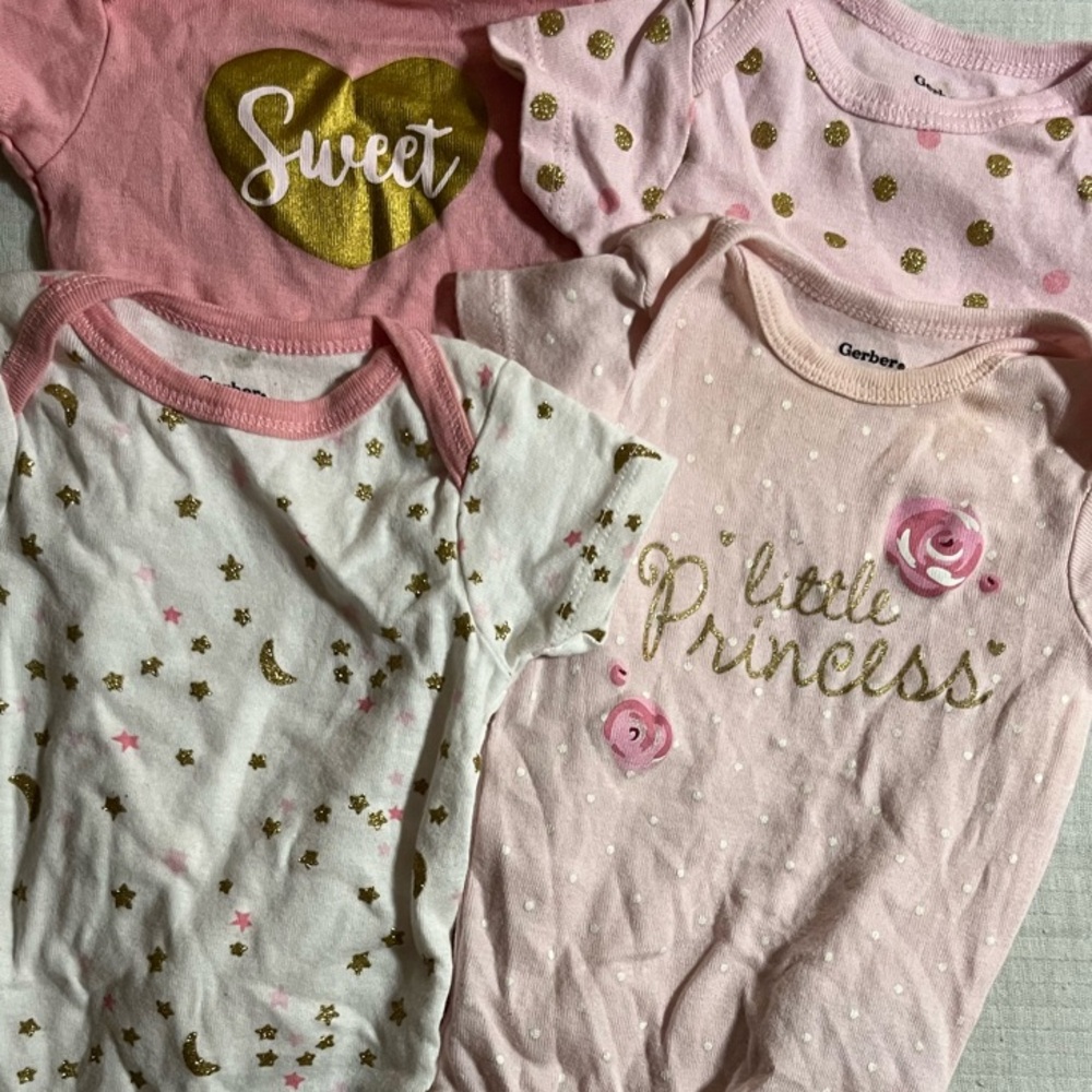 (4) 0-3m Gerber Gold, Pink, & White Bodysuits (SLIGHT DISCOLORATION ON 1)
